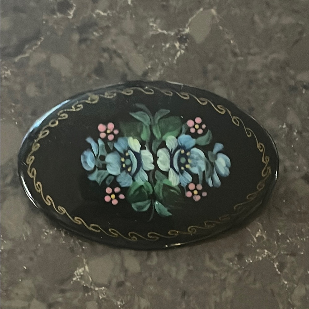 Elegant Black and Blue Floral Brooch with Ornate Detailing